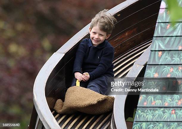 James, Viscount Severn, son of Prince Edward, Earl of Wessex and Sophie, Countess of Wessex slides down the fun fair helter skelter on day 4 of the...