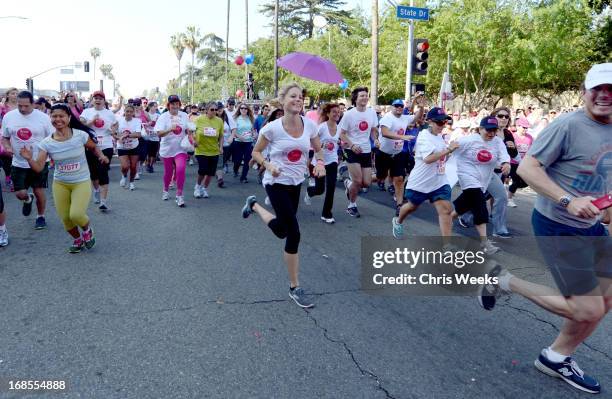 Host Julie Bowen runs during the 20th Annual EIF Revlon Run/Walk For Women at Los Angeles Memorial Coliseum on May 11, 2013 in Los Angeles,...