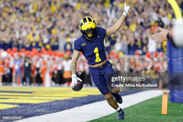 Roman Wilson of the Michigan Wolverines celebrates after catching a touchdown pass in the first quarter of a game against the Bowling Green Falcons...