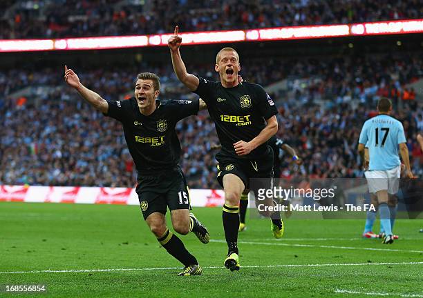 Ben Watson of Wigan Athletic celebrates scoring the only goal with team mate Callum McManaman during the FA Cup with Budweiser Final match between...