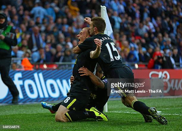 Ben Watson of Wigan Athletic celebrates scoring the only goal with team mate Callum McManaman during the FA Cup with Budweiser Final match between...