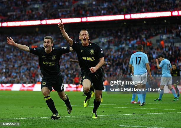 Ben Watson of Wigan Athletic celebrates scoring the only goal with team mate Callum McManaman during the FA Cup with Budweiser Final match between...