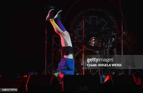 Red Hot Chili Peppers' member Flea walks on his hands during the Global Citizen Festival at Central Park in New York City on September 23, 2023.