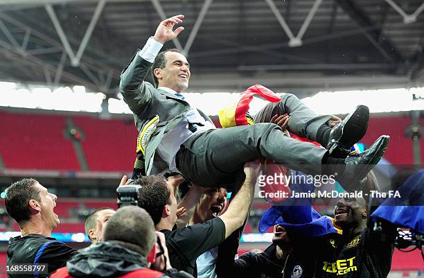Wigan Athletic manager Roberto Martinez is thrown in the air by his players as they celebrate victory in the FA Cup with Budweiser Final match...