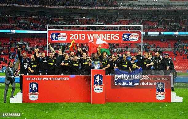 Wigan Athletic players celebrate victory after the FA Cup with Budweiser Final between Manchester City and Wigan Athletic at Wembley Stadium on May...
