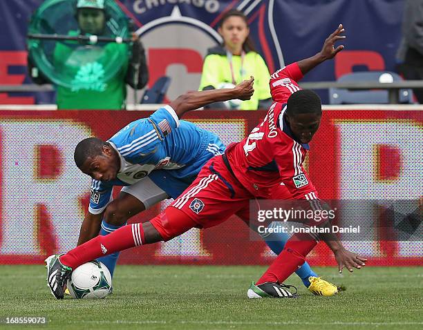 Patrick Nyarko of the Chicago Fire tries to control the ball under pressure from Raymon Gaddis of the Philadelphia Union during an MLS match at...