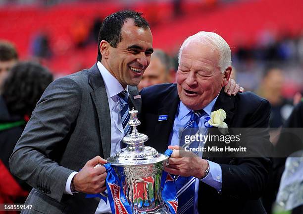 Manager Roberto Martinez of Wigan Athletic and Wigan chairman Dave Whelan celebrate with the trophy following his team's 1-0 victory during the FA...