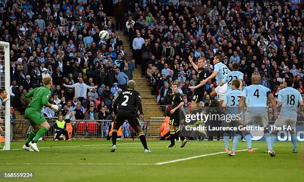 Ben Watson of Wigan Athletic heads in the winning goal during the FA Cup with Budweiser Final match between Manchester City and Wigan Athletic at...