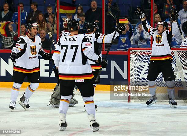 Patrick Hager of Germany celebrate with his team mates after he scores his team's 2nd goal during the IIHF World Championship group H match between...