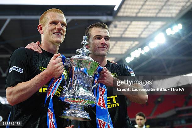 Goalscorer Ben Watson of Wigan Athletic and Callum McManaman celebrate with the trophy after victory in the FA Cup with Budweiser Final match between...