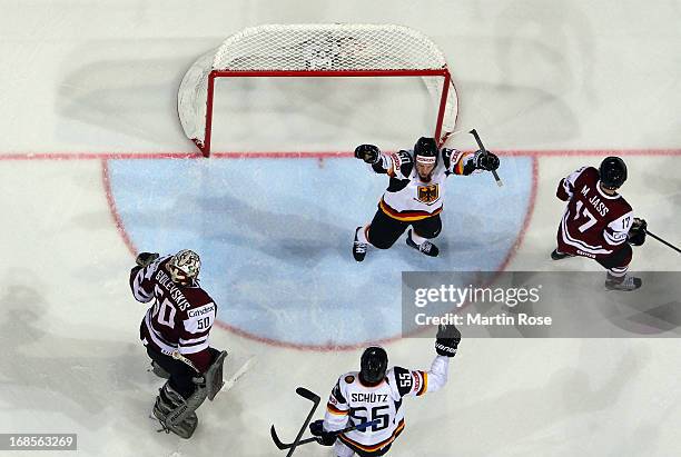 Patrick Hager of Germany celebrate with his team mates after he scores his team's 2nd goal during the IIHF World Championship group H match between...