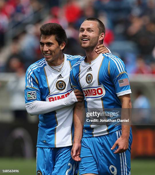 Jack McInerney and Michael Farfan of the Philadelphia Union celebrate McInerney's game winning goal against Chicago Fire during an MLS match at...