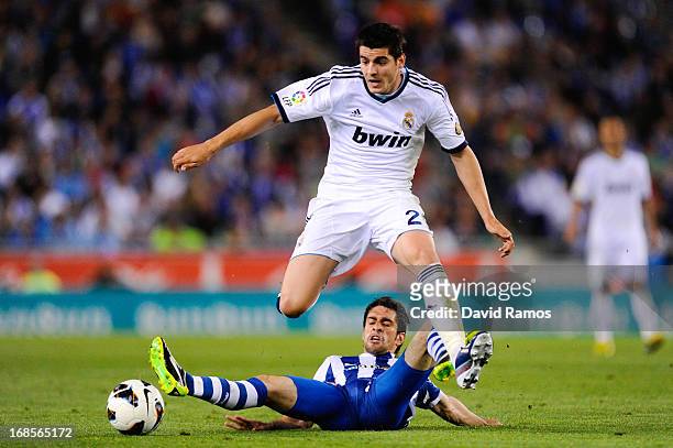 Alvaro Morata of Real Madrid CF duels for the ball with Juan Forlin of RCD Espanyol during the La Liga match between RCD Espanyol and Real Madrid CF...