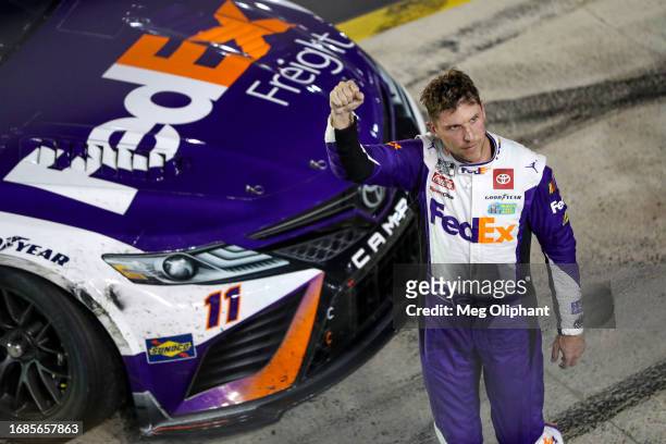 Denny Hamlin, driver of the FedEx Freight Direct Toyota, celebrates after winning the NASCAR Cup Series Bass Pro Shops Night Race at Bristol Motor...