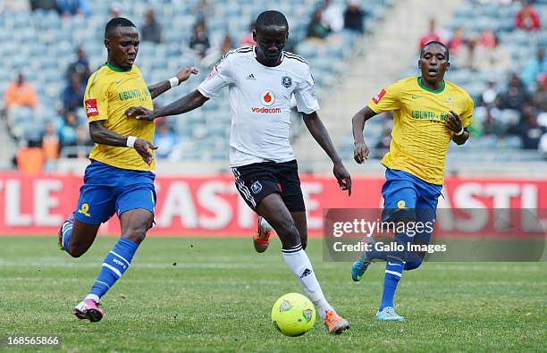 Teko Modise of Sundowns and Onyekachi Okonkwo of Pirates during the Absa Premiership match between Orlando Pirates and Mamelodi Sundowns at Orlando...