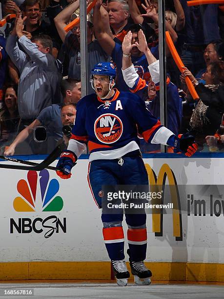 John Tavares of the New York Islanders cheers his goal along with fans in the first period against the Pittsburgh Penguins in Game Six of the Eastern...
