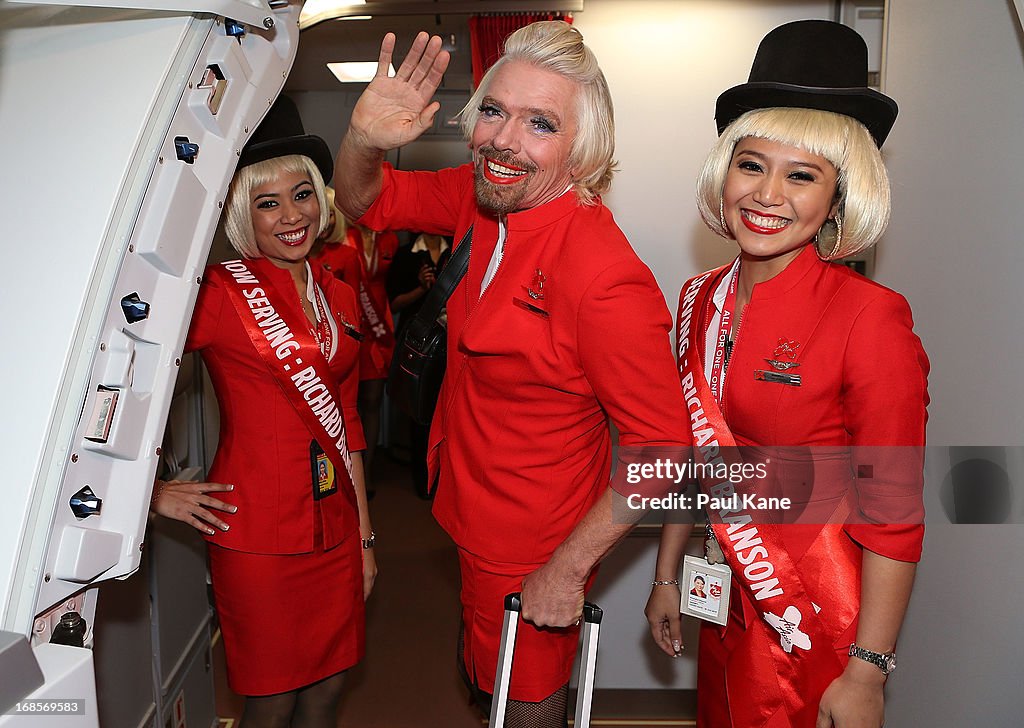 "Stewardess" Richard Branson Serves Passengers On AirAsia Flight