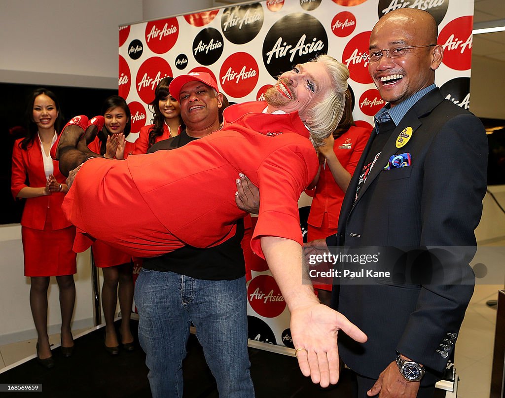 "Stewardess" Richard Branson Serves Passengers On AirAsia Flight