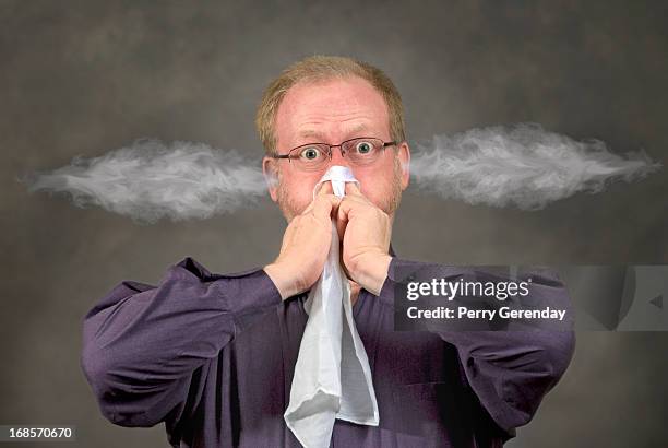 nose blower, smoke ears - blowing nose stock pictures, royalty-free photos & images