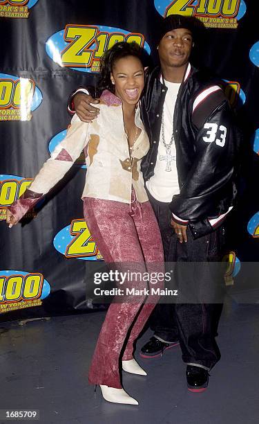 Musician Ashanti poses with rapper Ja Rule during "Z100's Jingle Ball 2002" holiday concert on December 12, 2002 at Madison Square Garden in New York...