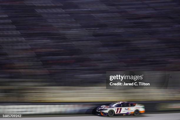 Denny Hamlin, driver of the FedEx Freight Direct Toyota, drives during the NASCAR Cup Series Bass Pro Shops Night Race at Bristol Motor Speedway on...