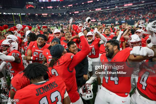 The UNLV Rebels celebrate the team's 40-37 victory over the Vanderbilt Commodores at Allegiant Stadium on September 16, 2023 in Las Vegas, Nevada.