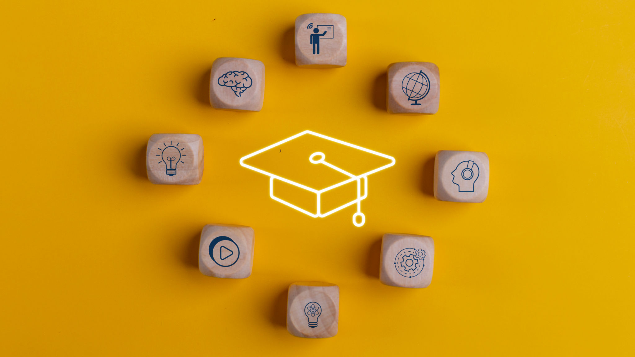Knowledge and teaching. Wooden cubes with graduation and education symbols. Success and necessary skills in graduation or education. Knowledge and teaching. Wooden cubes with graduation and education symbols. Success and necessary skills in graduation or education.