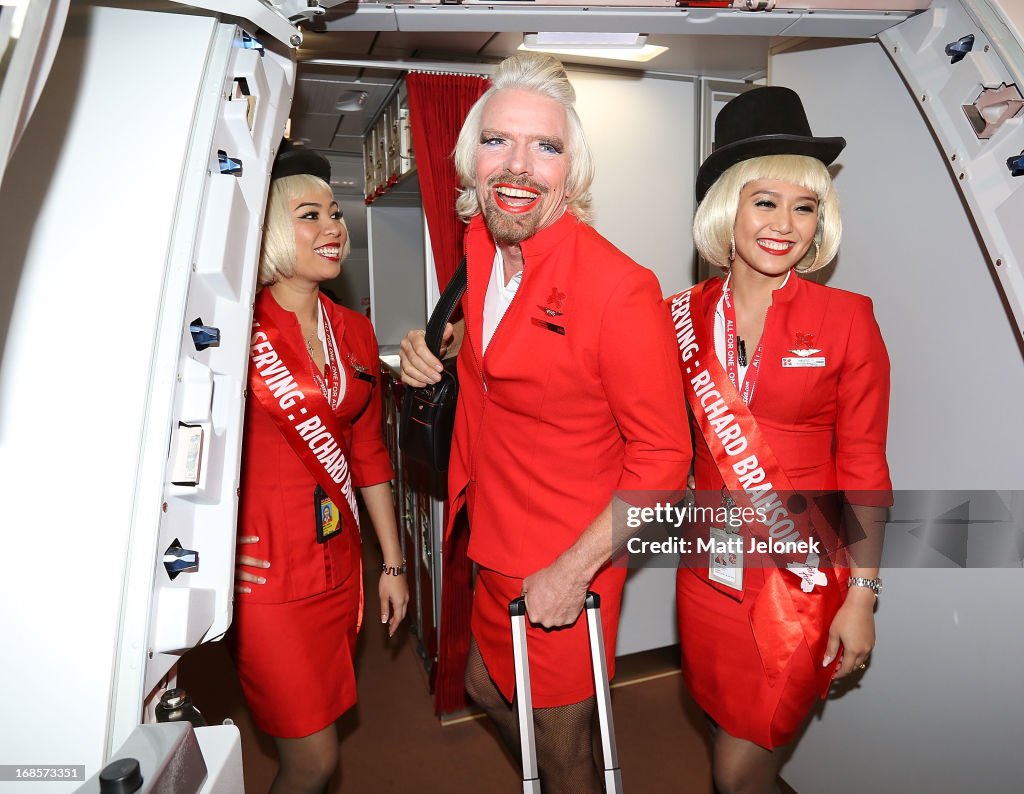 "Stewardess" Richard Branson Serves Passengers On AirAsia Flight