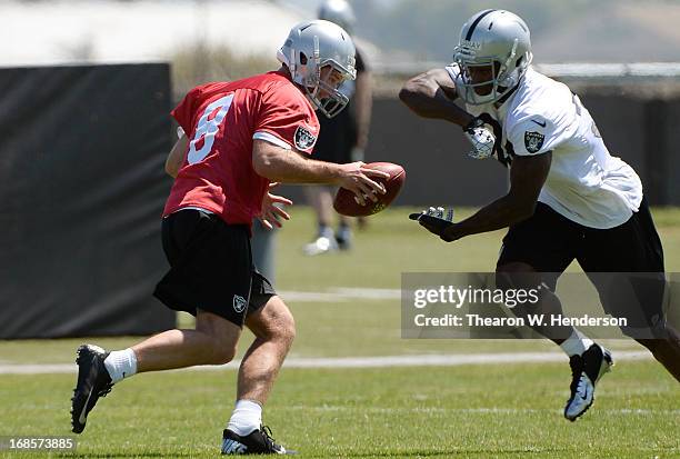 Latavius Murray and Tyler Wilson of the Oakland Raiders participates in drills during Rookie Mini-Camp on May 11, 2013 in Alameda, California.