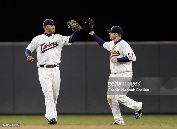 Wilkin Ramirez and Chris Parmelee of the Minnesota Twins celebrate a win of the game against the Baltimore Orioles on May 11, 2013 at Target Field in...