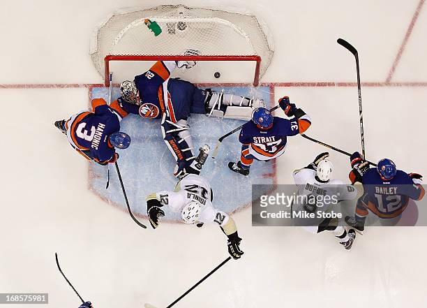 Jarome Iginla of the Pittsburgh Penguins scores a goal on Evgeni Nabokov of the New York Islanders in Game Six of the Eastern Conference...