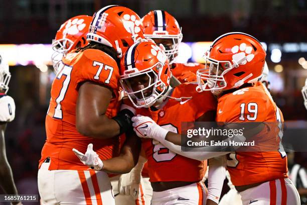 The Clemson Tigers celebrate a touchdown by teammate Tyler Brown against the Florida Atlantic Owls in the third quarter at Memorial Stadium on...