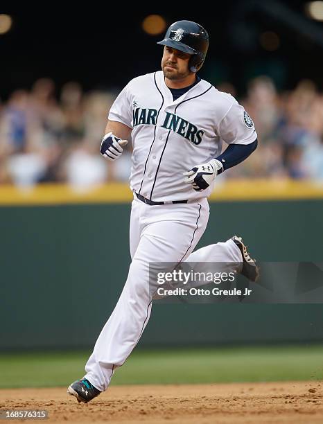Kelly Shoppach of the Seattle Mariners rounds the bases after hitting a home two-run homer in the fifth inning against the Oakland Athletics at...