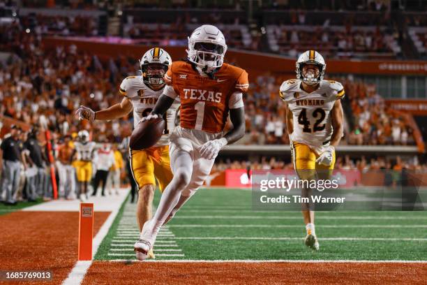 Xavier Worthy of the Texas Longhorns scores a touchdown in the fourth quarter against the Wyoming Cowboys at Darrell K Royal-Texas Memorial Stadium...