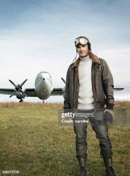 retro pilot and his airplane - jacket stock pictures, royalty-free photos & images