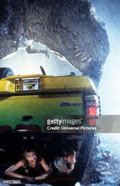 Ariana Richards and Joseph Mazzello are trapped in a truck in a scene from the film 'Jurassic Park', 1993.