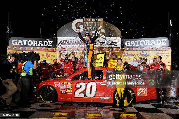 Matt Kenseth, driver of the The Home Depot / Husky Toyota, celebrates with his crew in victory lane after winning the NASCAR Sprint Cup Series...