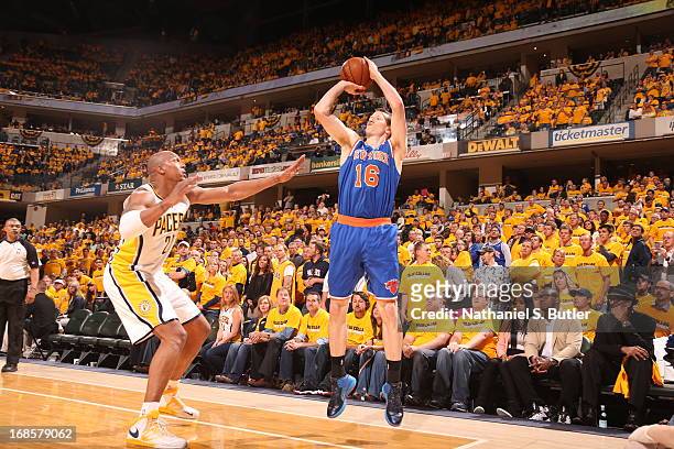 Steve Novak of the New York Knicks shoots a three pointer against David West of the Indiana Pacers in Game Three of the Eastern Conference Semifinals...