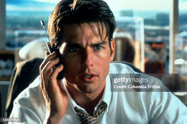 Tom Cruise talks on a phone in a scene from the film 'Jerry Maguire', 1996.