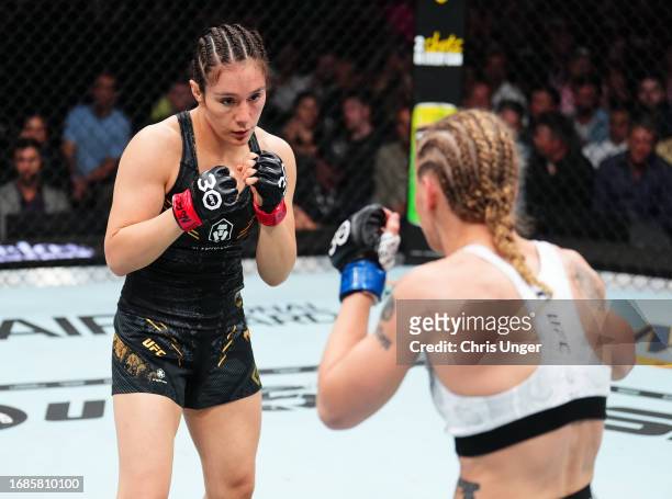 Alexa Grasso of Mexico battles Valentina Shevchenko of Kyrgyzstan in the UFC flyweight championship fight during the Noche UFC event at T-Mobile...