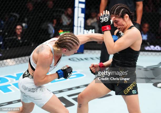 Valentina Shevchenko of Kyrgyzstan punches Alexa Grasso of Mexico in the UFC flyweight championship fight during the Noche UFC event at T-Mobile...