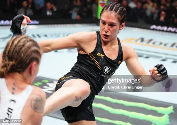 Alexa Grasso of Mexico kicks Valentina Shevchenko of Kyrgyzstan in the UFC flyweight championship fight during the Noche UFC event at T-Mobile Arena...