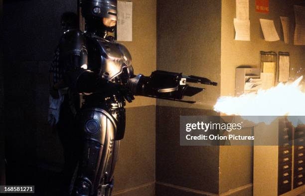 Robert John Burke fires a flamethrower in a scene from the film 'RoboCop 3', 1993.