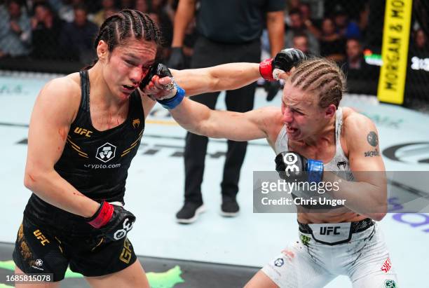 Valentina Shevchenko of Kyrgyzstan punches Alexa Grasso of Mexico in the UFC flyweight championship fight during the Noche UFC event at T-Mobile...