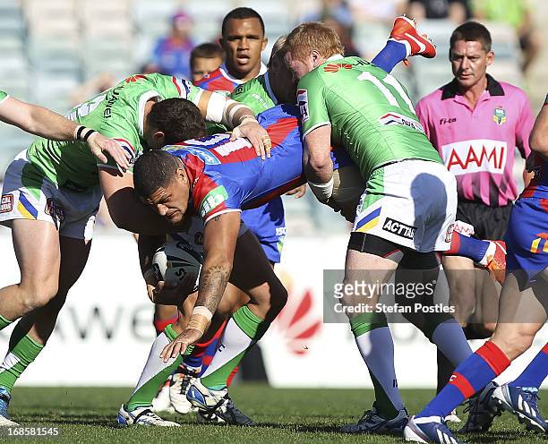 Willie Mason of the Knights is tackled during the round nine NRL match between the Canberra Raiders and the Newcastle Knights at Canberra Stadium on...