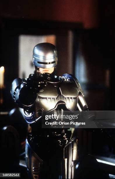 Robert John Burke points a gun in a scene from the film 'RoboCop 3', 1993.