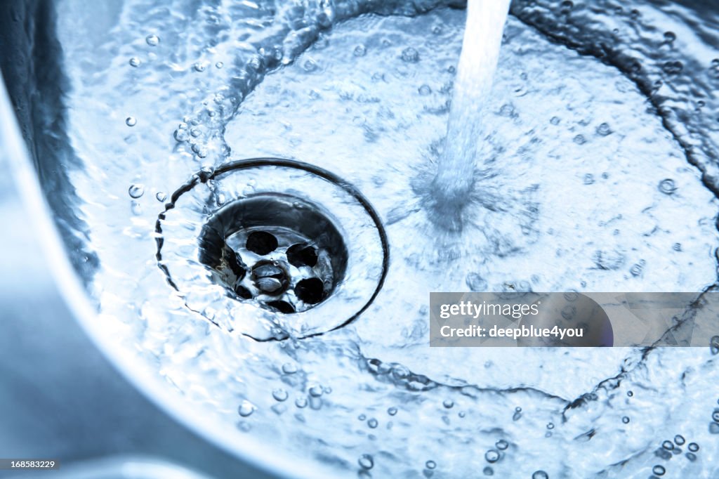 Kitchen sink with running water