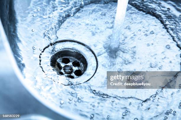 kitchen sink with running water - sjunken bildbanksfoton och bilder