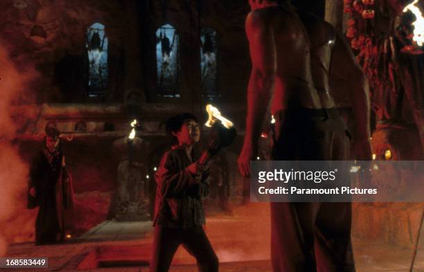Jonathan Ke Quan faces off against a brainwashed Harrison Ford in a scene from the film 'Indiana Jones And The Temple Of Doom', 1984.