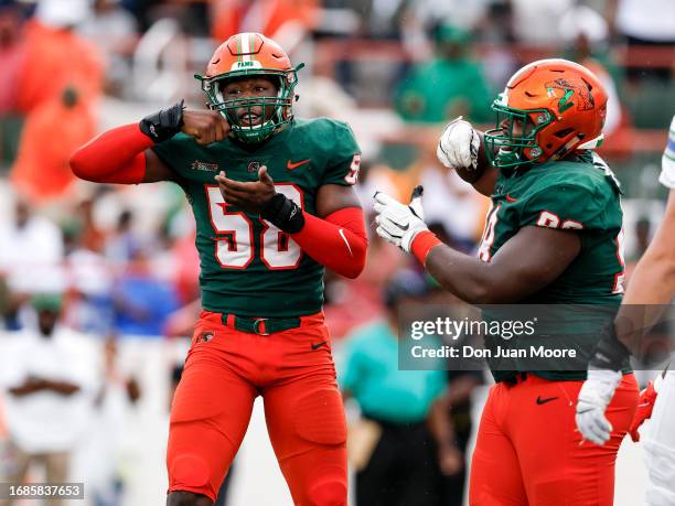 Defensive Lineman Anthony Dunn Jr. #58 and Stanley Mentor of the Florida A&M Rattlers celebrates after making a tackle against the West Florida...